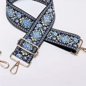 Blue, off white and black purse strap. New. Looks like tapestry t…